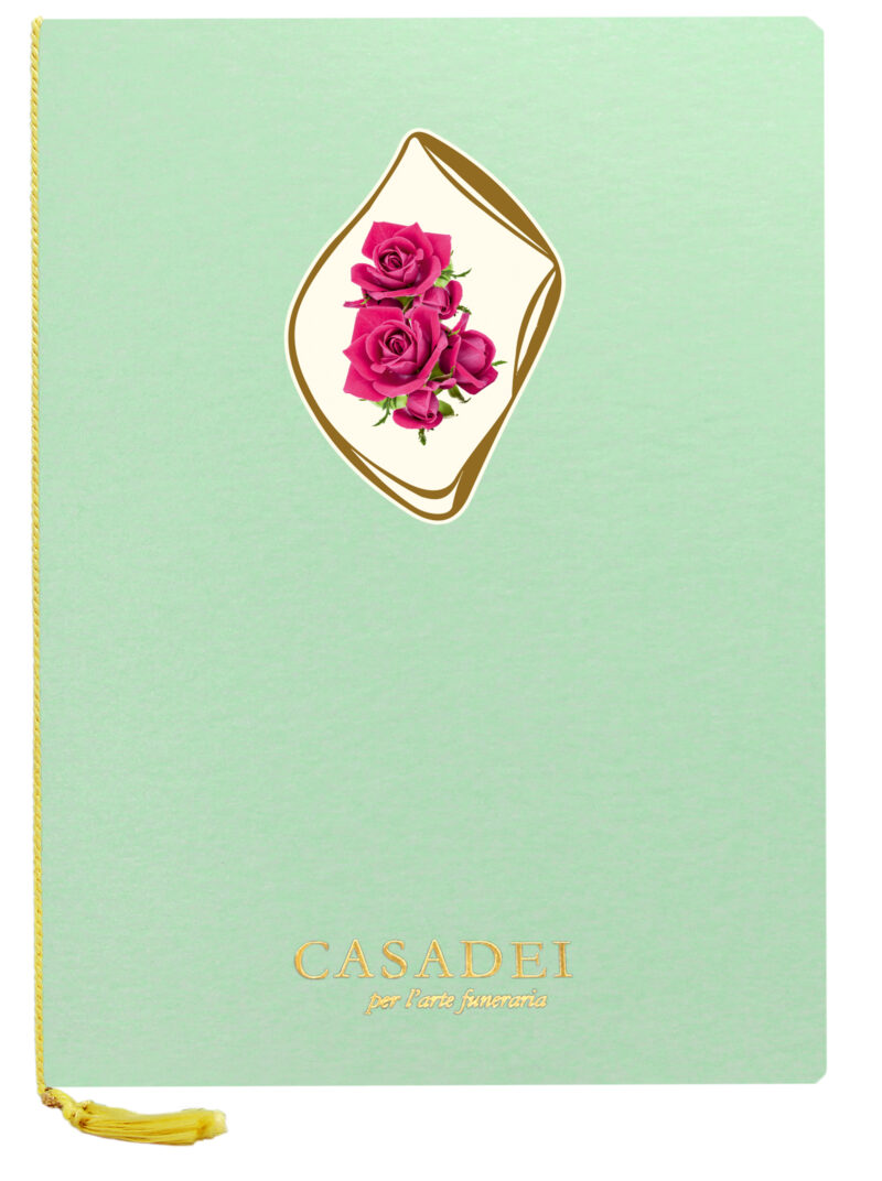 Libro delle condoglianze con copertina sagomata ovale immagine Croce e rose in cartone acqua marina, interno composto da una pagina "In memoria" e otto pagine per le firme in carta avorio, rilegato con cordoncino e nappa. 21x29,7 cm.