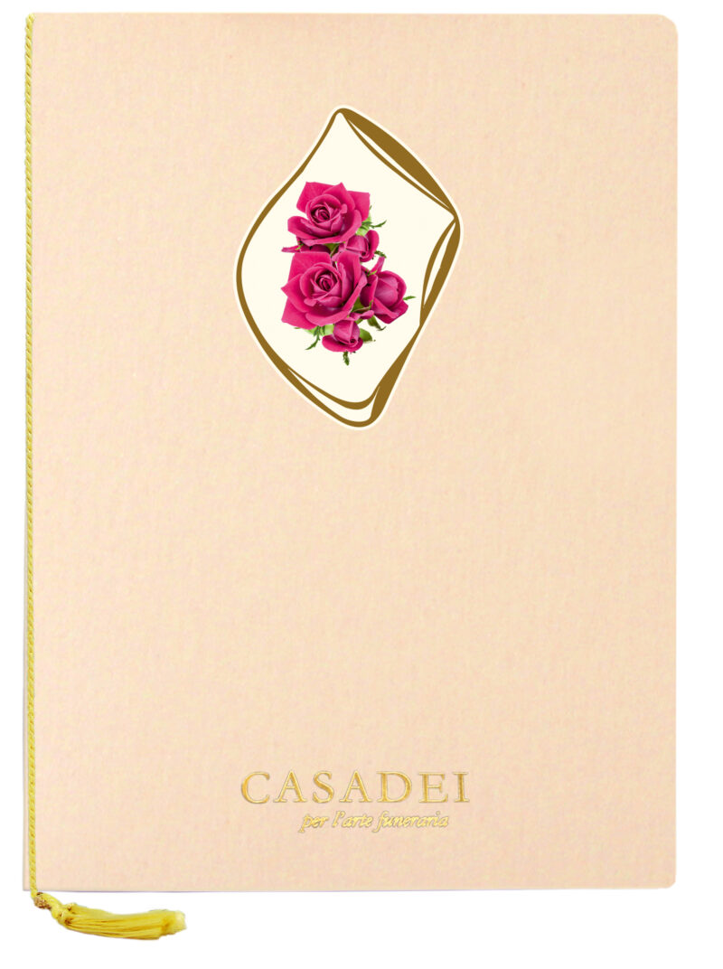 Libro delle condoglianze con copertina sagomata ovale immagine Croce e rose in cartone rosa, interno composto da una pagina "In memoria" e otto pagine per le firme in carta avorio, rilegato con cordoncino e nappa. 21x29,7 cm.